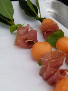 fresh melon, herb and prosciutto skewers on sheet