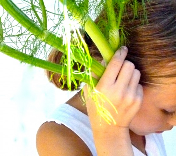 fennel as headphones on a little girl