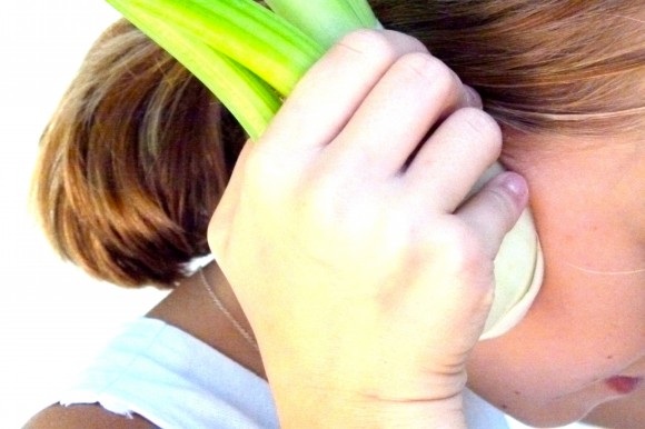 fennel as headphones on girl