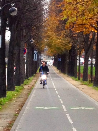 fall in paris a man on a  bike by the seine