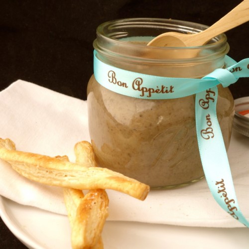 Mushroom soup in glass jar with truffle breadsticks