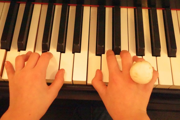 girls hands at piano with mushroom ring