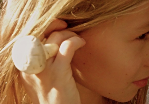 girls hands in hair with mushroom ring