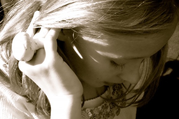 girls hands in hair with mushroom ring