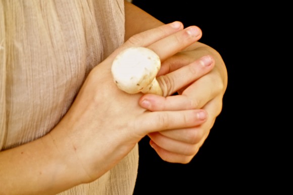 girl with mushroom on finger as a ring