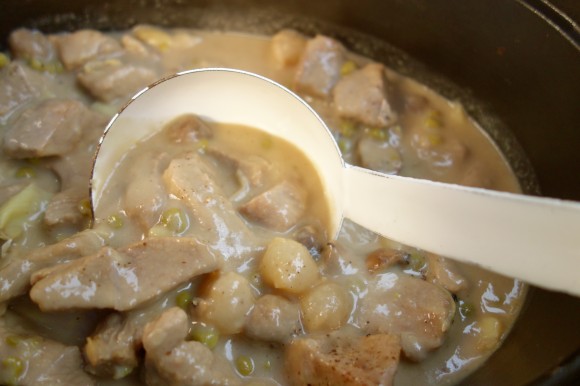 la blanquette de veau   (veal stew in a white wine-crème fraîche sauce with mushrooms, pearl onions, and artichoke hearts on garlic-rubbed toasted French Bread)   