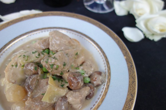 la blanquette de veau   (veal stew in a white wine-crème fraîche sauce with mushrooms, pearl onions, and artichoke hearts on garlic-rubbed toasted French Bread) 