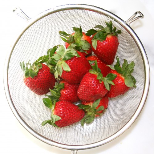 strawberries in strainer 