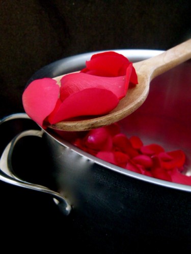 valentines day rose petals spooned out of a pot