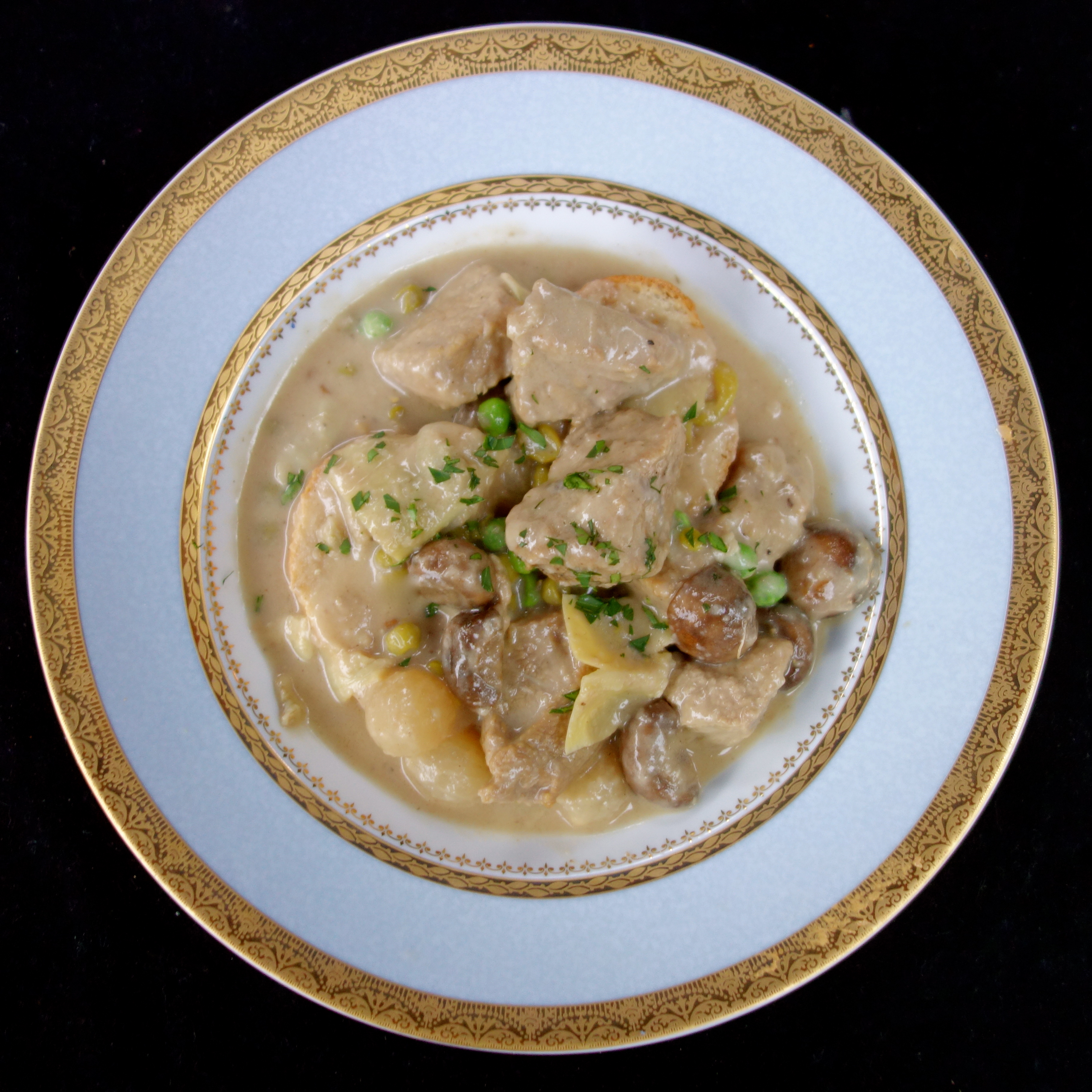 la blanquette de veau   (veal stew in a white wine-crème fraîche sauce with mushrooms, pearl onions, and artichoke hearts