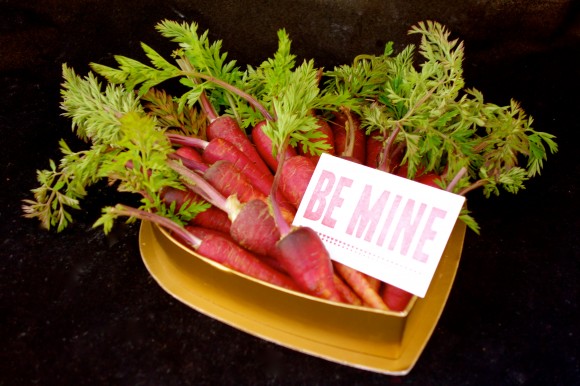 valentines day red carrots, with a Be mine sign