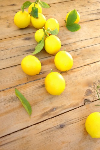 fresh lemons on a wood table