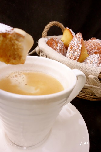 Madeleines dunking into tea