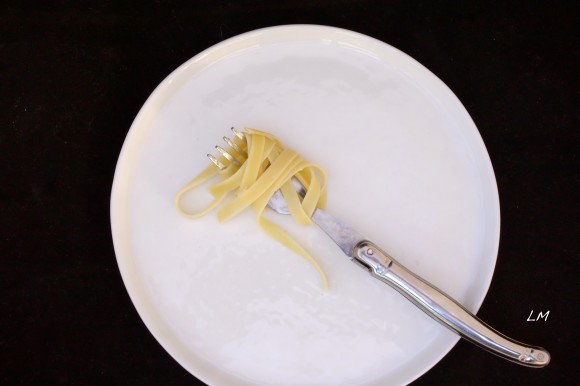 fettechini pasta with fork on a plate